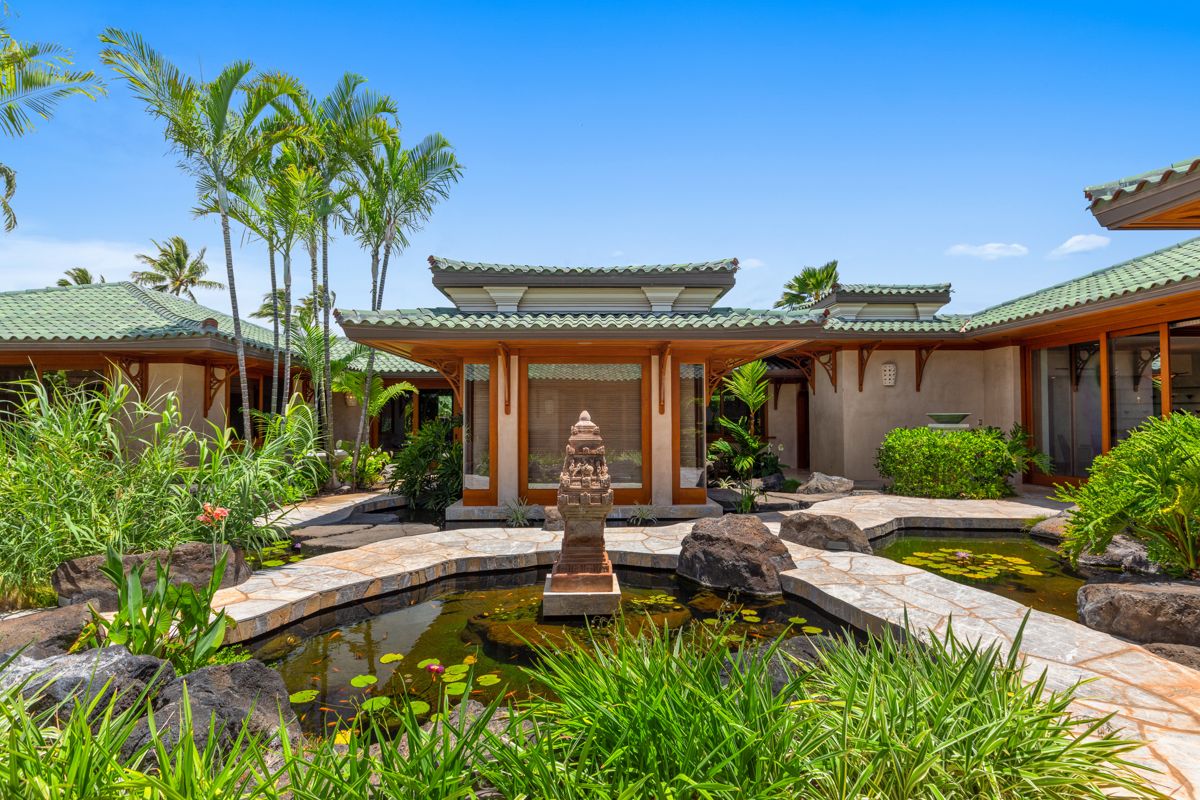 Hawaiian-style residence with koi pond gardens
